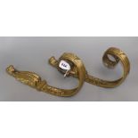 A pair of Empire style gilt metal curtain pole brackets length 35cm