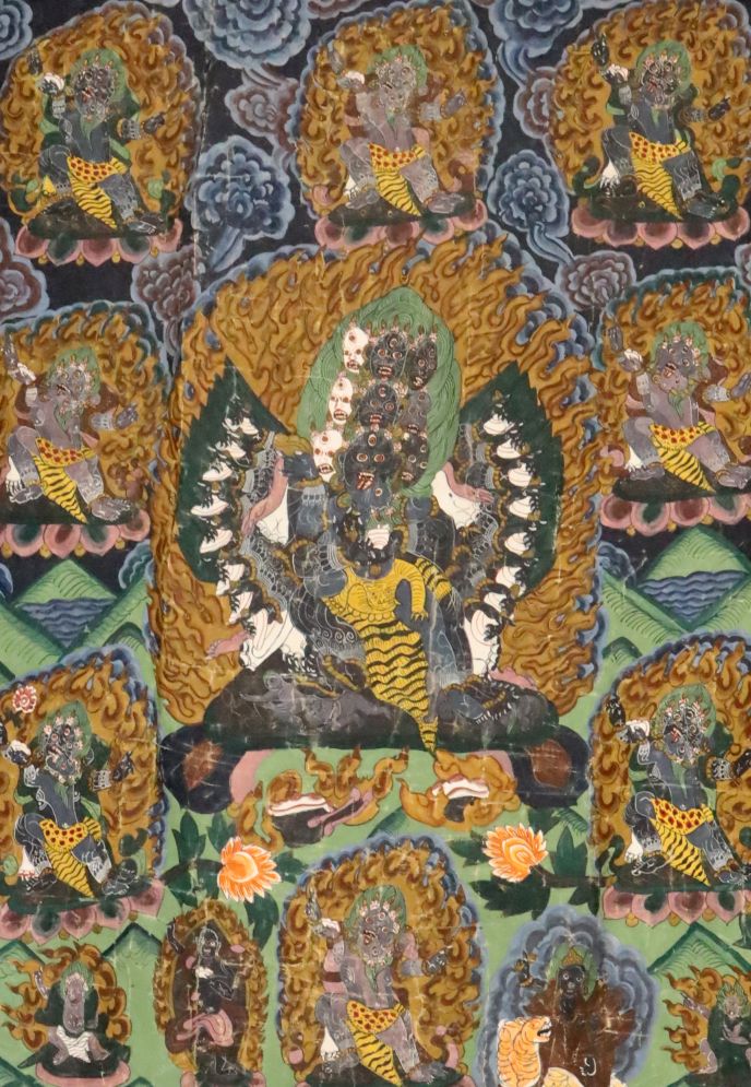 A thangka depicting a Buddhist wrathful deity, Tibet, first half 20th century, surrounded other