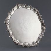 A George II silver salver by Robert Abercrombie, of shaped circular form, with engraved armorial and