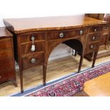 A George III cross-banded mahogany serpentine sideboard W.162cm