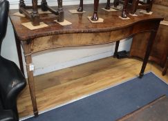 A George III mahogany serpentine serving table W.152cm