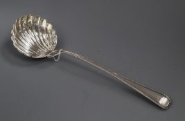 A Victorian silver beaded Old English pattern soup ladle by George Adams, London, 1869, 34cm, 8 oz.