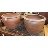 A pair of large glazed earthenware planters Diam.64cm