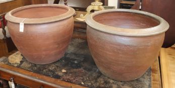 A pair of large glazed earthenware planters Diam.64cm