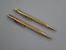 A 9ct gold cased pencil and a 585 cased pen.