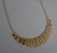 A 1980's Italian Uno-a-Erre 9ct gold fringe necklace, 46cm, 14 grams.