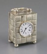 A late Victorian silver cased carriage timepiece, with textured basket weave decoration, maker, G.B,