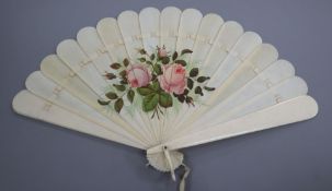 A late 19th century ivory fan painted with pink roses 23cm long