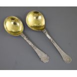 Two 18th century Scandinavian silver spoons, with gilded bowls and both terminals engraved with