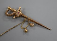 A yellow metal and gem set jabot? pin, modelled as a sword with scabbard, 71mm.