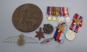 A death mask and mixed medals