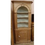 A Georgian style pine barrel back standing corner cabinet, W.92cm