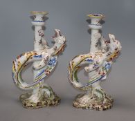 A pair of French faience pottery armorial candlesticks H.26cm