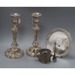 A pair of Old Sheffield plate candlesticks, a plated waiter and a pierced plated chamberstick,