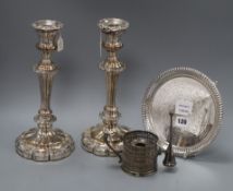 A pair of Old Sheffield plate candlesticks, a plated waiter and a pierced plated chamberstick,