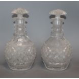 A pair of cut glass mallet decanters height 25cm