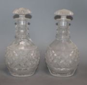 A pair of cut glass mallet decanters height 25cm