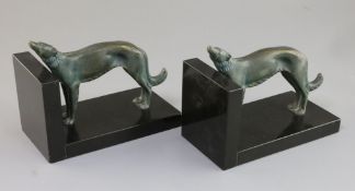 Constant Roux. A pair of bronze and black marble bookends, modelled with standing borzoi, 7in.