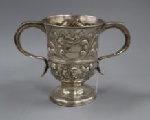 A George III later embossed silver two handled cup (a.f), William & James Priest, London, 1765 15.