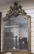 A silvered wood wall mirror with cherub crest H.108cm