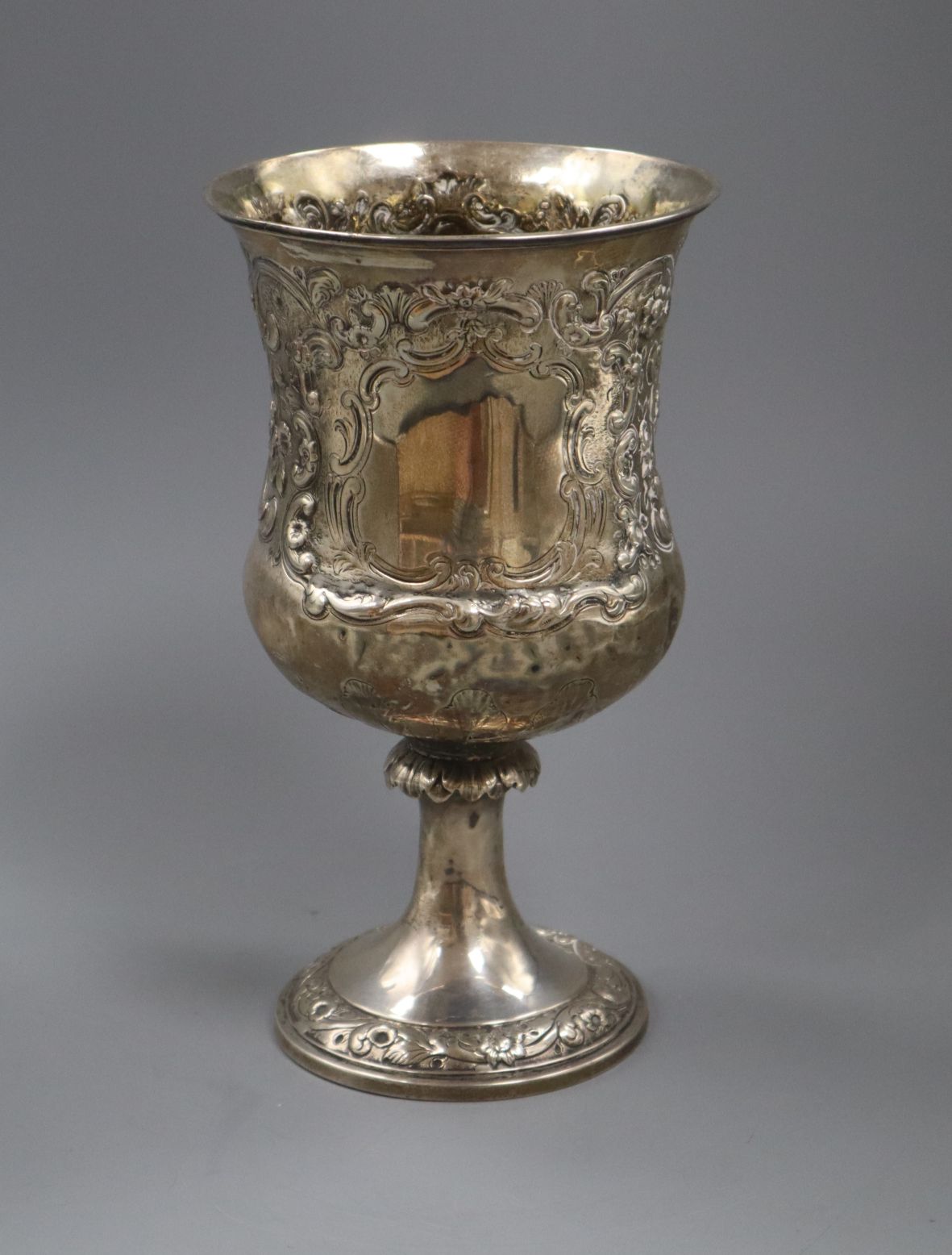 A George IV embossed silver campana shaped cup, J.E. Terry & Co, London, 1829 (stem a.f.), 23cm,