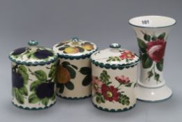 A set of three Weymss lidded jars and a Wemyss style vase