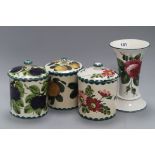 A set of three Weymss lidded jars and a Wemyss style vase