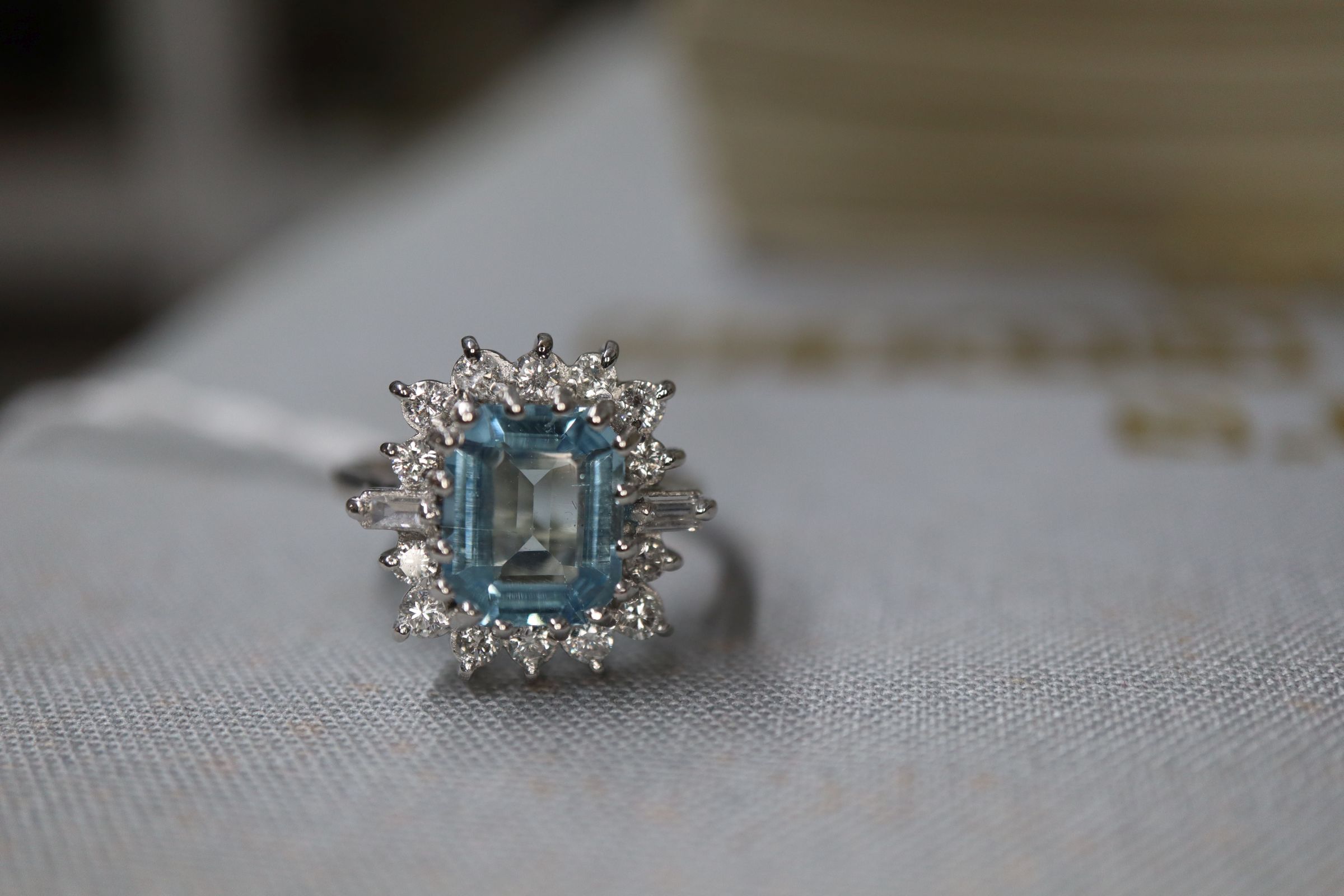 A modern 18ct white metal, aquamarine, baguette and round cut diamond set cluster ring, size K/L. - Image 6 of 6