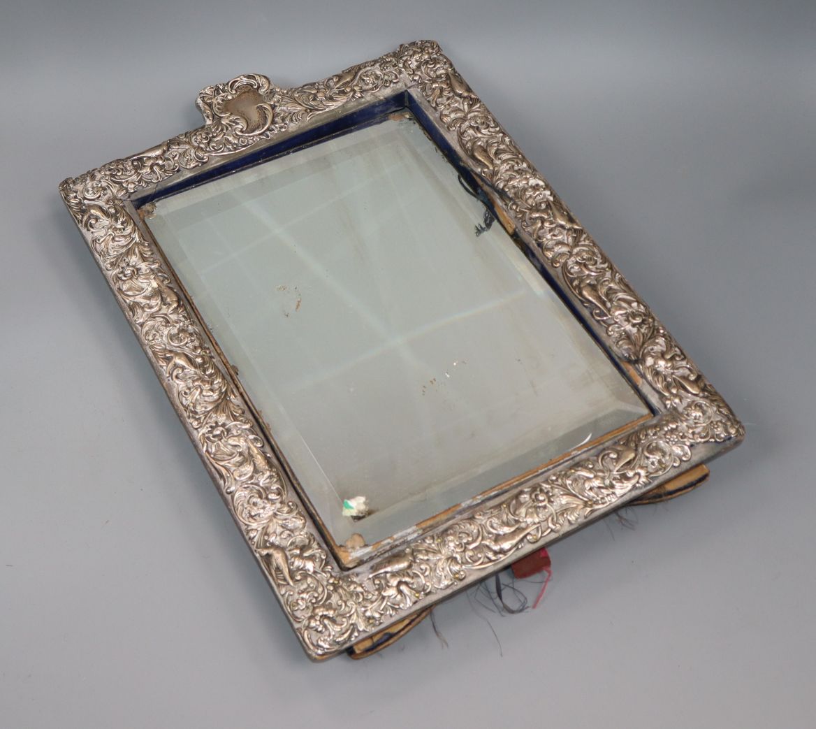 An Edwardian repousse silver mounted rectangular easel mirror, William Comyns, London, 1905, 43.