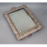 An Edwardian repousse silver mounted rectangular easel mirror, William Comyns, London, 1905, 43.