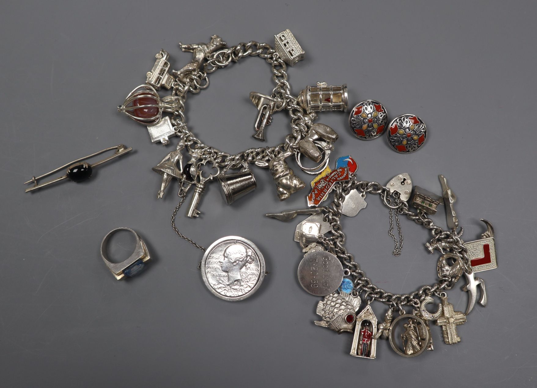 Mixed silver jewellery including two charm bracelets.