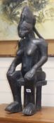 A Yoruba ebonised wood figure of a seated woman height 70cm