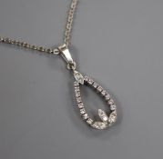 A white metal and diamond pear shaped openwork pendant, on a 14k white metal chain, pendant 20mm.