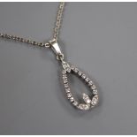 A white metal and diamond pear shaped openwork pendant, on a 14k white metal chain, pendant 20mm.