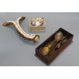 A stag antler cribbage board, a shell encrusted box and a collection of horn spoons cribbage board