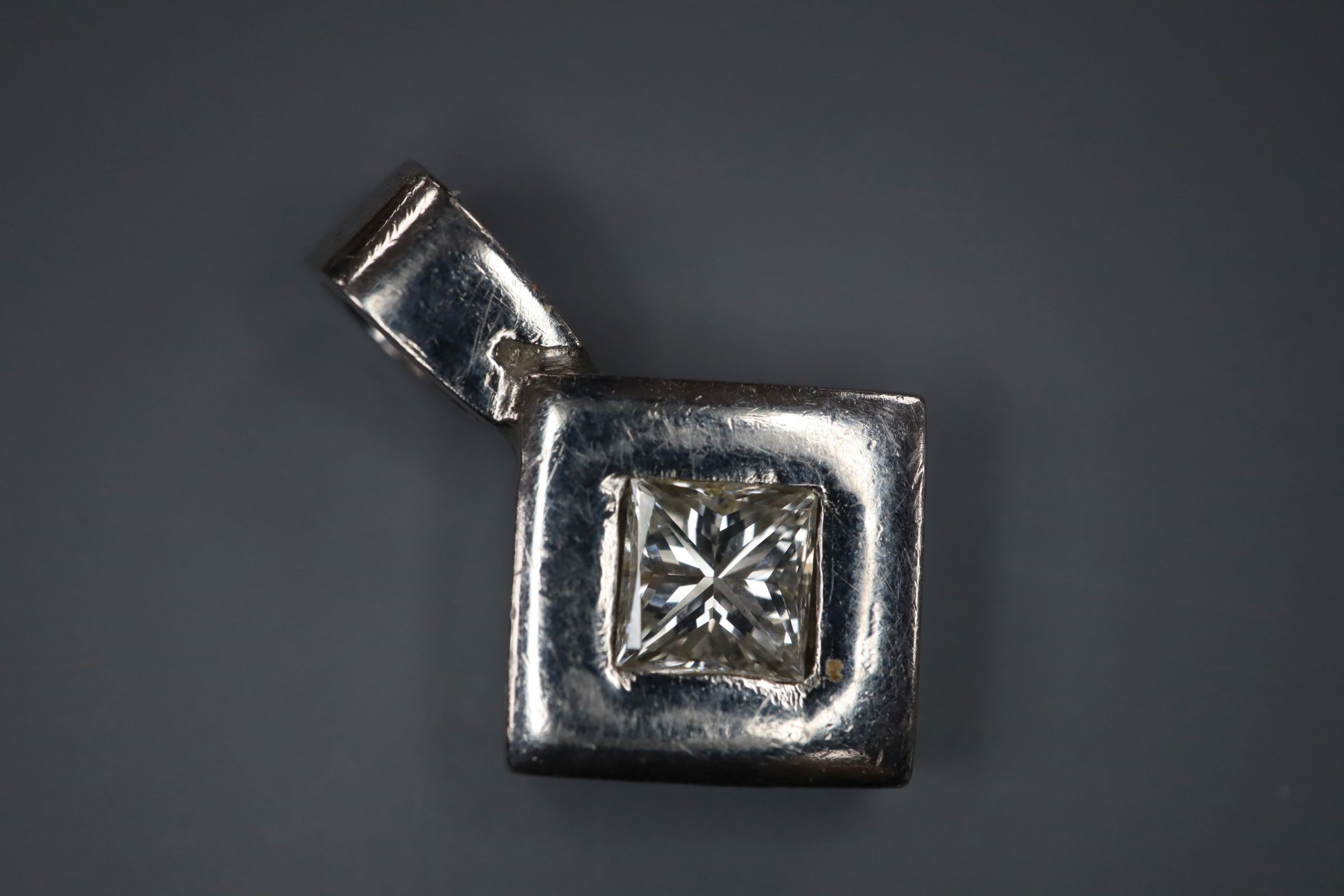 A white metal (stamped plat) and princess cut diamond set pendant, overall 18mm. - Image 2 of 2