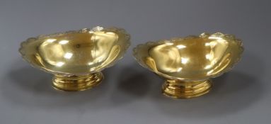 A pair of modern silver gilt oval pedestal dishes, Birmingham, 1970, 16cm, 9 oz.