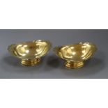 A pair of modern silver gilt oval pedestal dishes, Birmingham, 1970, 16cm, 9 oz.