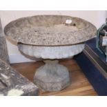 A reconstituted garden urn on stand Diameter 62cm