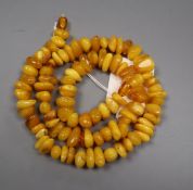 A single strand irregular shaped amber bead necklace, gross weight 73 grams, 62cm.