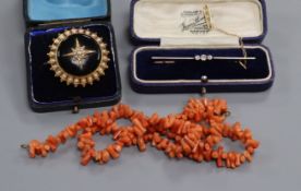 An Edwardian 15ct and diamond bar brooch, a Victorian seed pearl and enamel brooch and a coral