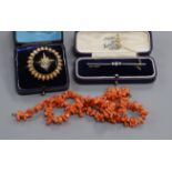 An Edwardian 15ct and diamond bar brooch, a Victorian seed pearl and enamel brooch and a coral