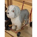 A plush toy on wheels