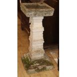 A reconstituted stone garden bird bath H.84cm