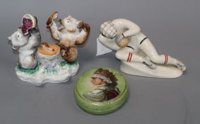 A Russian porcelain figure of a goalkeeper and a Russian porcelain inkwell and a box