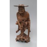 A Chinese wood figure of a luohan, early 20th century height 36cm