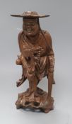 A Chinese wood figure of a luohan, early 20th century height 36cm