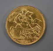 An Edward VII gold 1910 gold full sovereign.