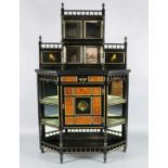 A Victorian Aesthetic Movement parcel gilt, ebonised and burr wood chiffonier, with raised
