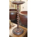 A Victorian carved walnut urn stand H.76cm